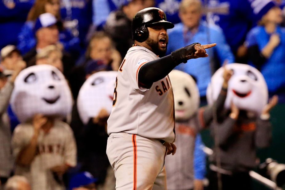 San Francisco Giants third baseman Pablo Sandoval celebrates after scoring in the fourth inning against the Kansas City Royals during Game 7 of the 2014 World Series at Kauffman Stadium on October 29 in Kansas City, Missouri. 