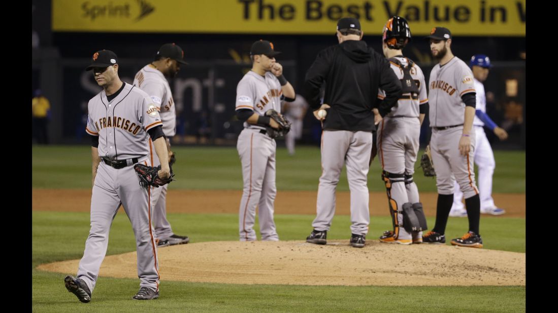 San Francisco Giants starting pitcher Tim Hudson, left, walks off the mound after being relieved during the second inning of Game 7 of the World Series on October 29 in Kansas City, Missouri. 