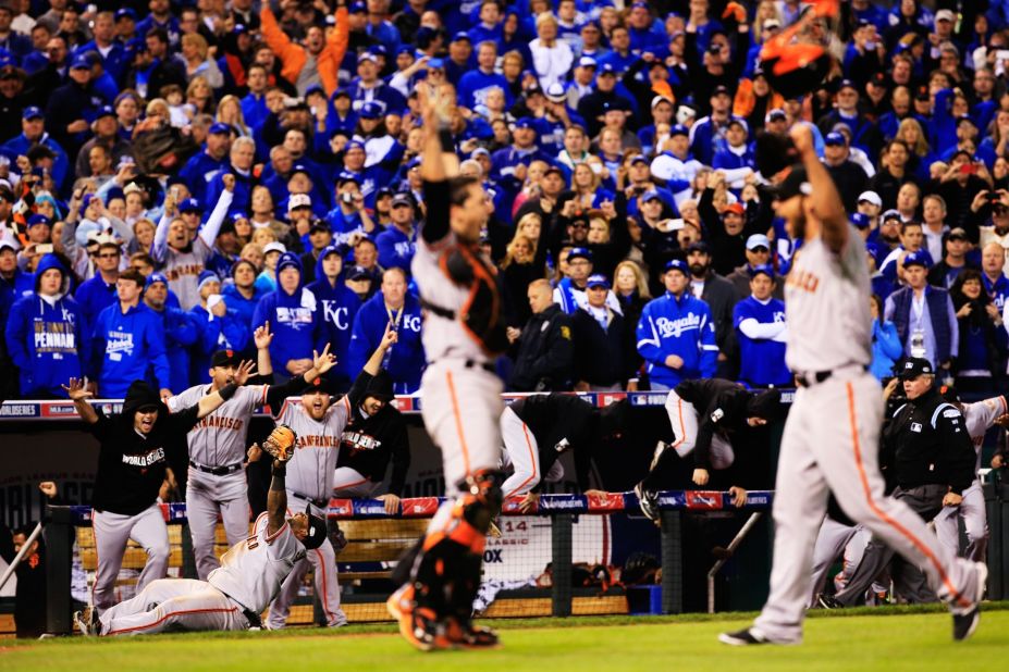 Members of the San Francisco Giants celebrate their 3-2 win over the Kansas City Royals in the 2014 World Series at Kauffman Stadium on October 29 in Kansas City, Missouri. 