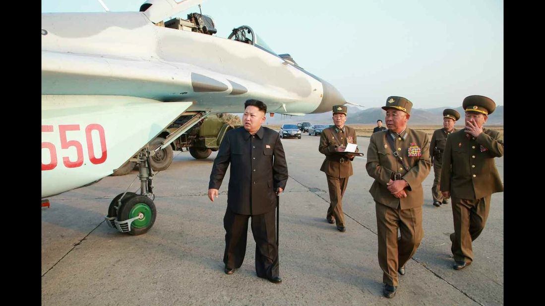 Kim is seen walking with a cane in this image released Thursday, October 30, by the state-run Korean Central News Agency.