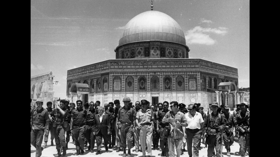 In June 1967, Israeli statesman David Ben-Gurion and Yitzhak Rabin lead a group of soldiers past the Dome of the Rock on the Temple Mount, on a victory tour following the Six Day War.