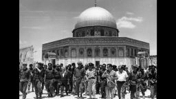 June 1967:  Israeli statesmen David Ben-Gurion (1886 - 1973) and Yitzhak Rabin (1922 - 1995) lead a group of soldiers past the 'Dome of the Rock' on the Temple Mount, on a victory tour following the Six Day War, Old Jerusalem, Israel.  (Photo by Hulton Archive/Getty Images)