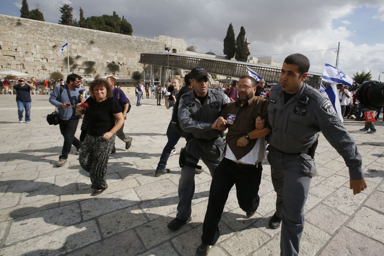 Israeli police detain activist Noam Federman after he tried to enter the Temple Mount on Thursday, October 30, in Jerusalem. Israel says it temporarily closed access to the Temple Mount "to prevent disturbances" after the drive-by shooting of controversial activist Rabbi Yehuda Glick. Israel partially reopened access to the Temple Mount for Muslim prayers Friday.