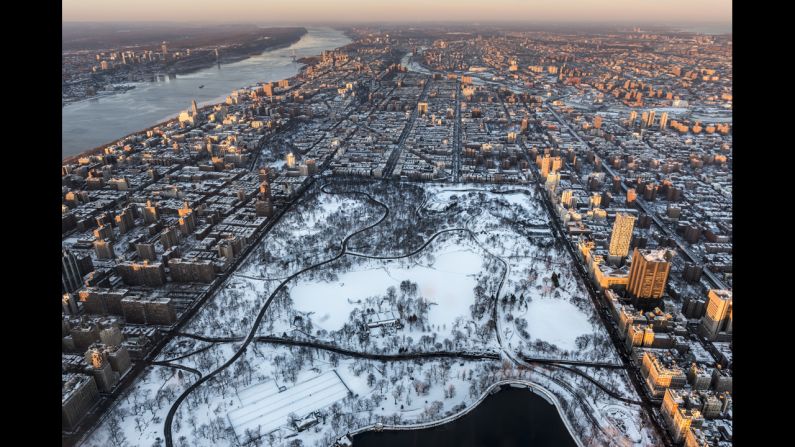 New York's Central Park is covered in snow in January.