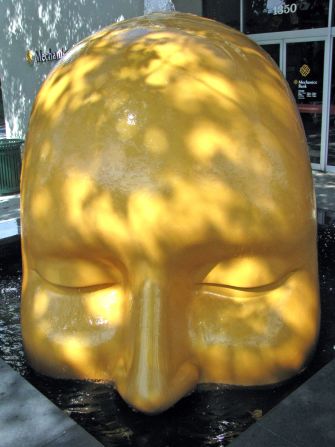 A water spout at the apex of a skull symbolizes birth, rebirth, wisdom and community at the Turning Heads Fountain in Walnut Creek, California.