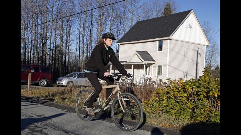 Kaci Hickox leaves her home in Fort Kent, Maine, to take a bike ride with her boyfriend on October 30, 2014. Hickox, a nurse, recently returned to the United States from West Africa, where she treated Ebola victims. State authorities wanted her to avoid public places for 21 days -- the virus' incubation period. But Hickox, who twice tested negative for Ebola,<a href="index.php?page=&url=http%3A%2F%2Fwww.cnn.com%2F2014%2F10%2F30%2Fhealth%2Fus-ebola%2Findex.html"> said she would defy efforts</a> to keep her quarantined at home.