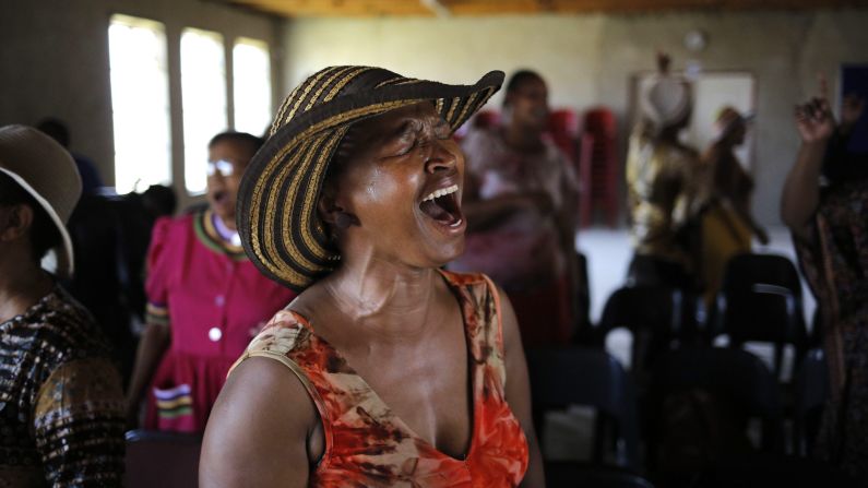 A woman cries at a Johannesburg church Tuesday, October 28, as she prays for Senzo Meyiwa, the captain of South Africa's soccer team who authorities say was <a href="http://www.cnn.com/2014/10/27/sport/football/football-world-mourns-senzo-meyiwa-death/index.html">shot and killed by intruders</a> during a botched robbery attempt.