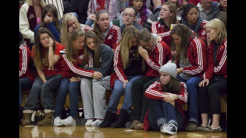 Students grieve during a gathering Sunday, October 26, at Marysville-Pilchuck High School in Marysville, Washington. Law enforcement officials say Jaylen Fryberg, a popular freshman at the school, <a href="http://www.cnn.com/2014/10/24/us/gallery/washington-school-shooting/index.html">shot five fellow students</a> before committing suicide on Friday, October 24.