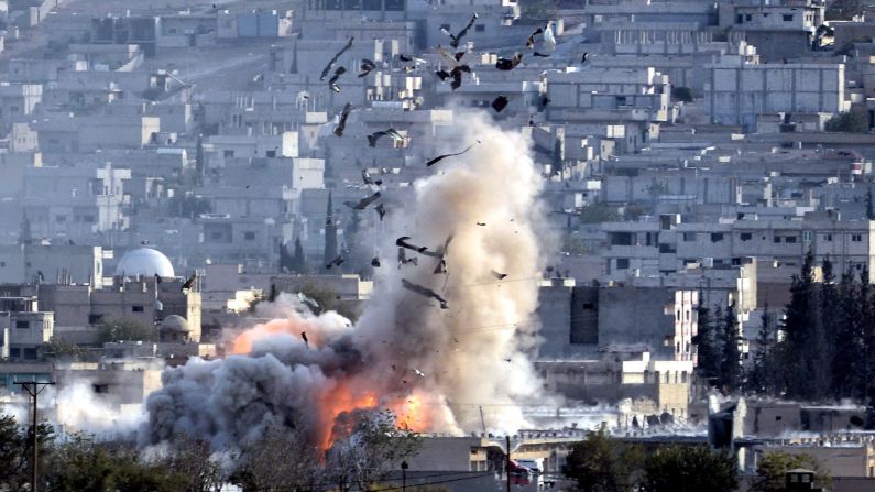 An explosion is seen in Kobani, Syria, after an apparent airstrike Monday, October 27. ISIS militants and Syrian Kurdish fighters have been battling for control of the city near the Turkish border, and the United States and several Arab nations have been bombing ISIS targets to take out the militant group's ability to command, train and resupply its fighters.