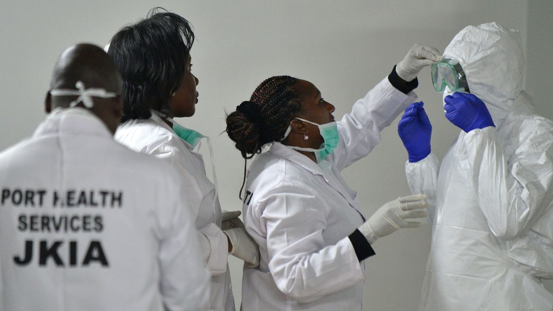 Health officials in Nairobi, Kenya, prepare to screen passengers arriving at the Jomo Kenyatta International Airport on October 28, 2014.