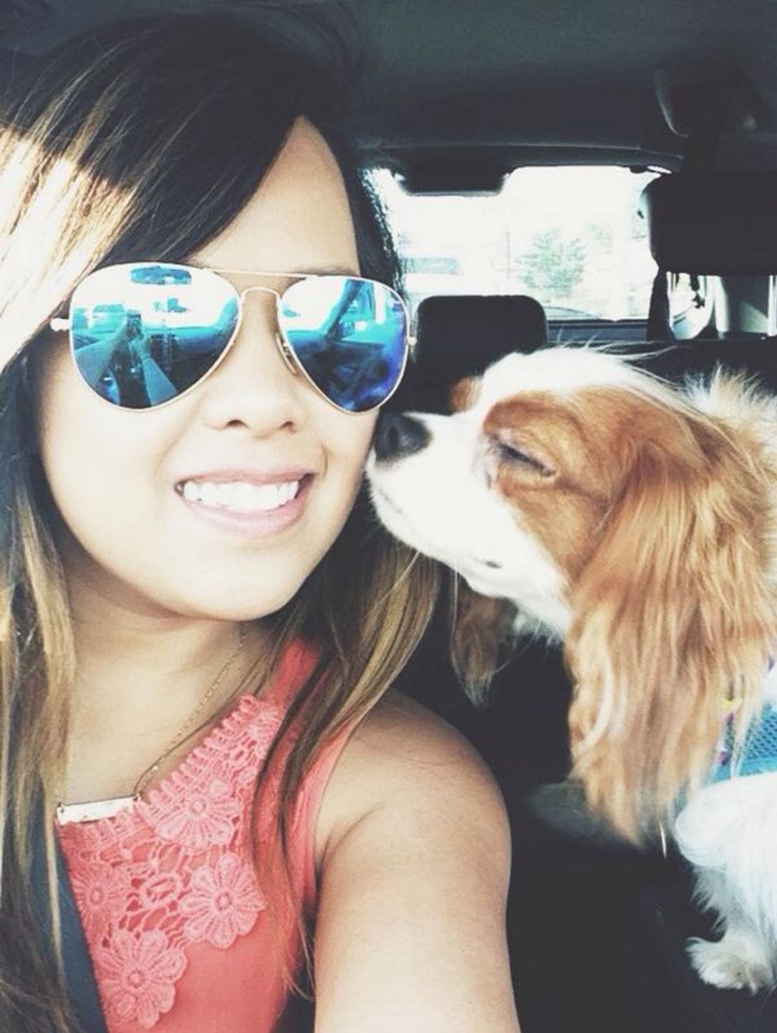 Nina Pham rides with her dog, Bentley, as seen in this photo from Facebook. After Pham's treatment for Ebola and Bentley's quarantine, the two were reunited Saturday.