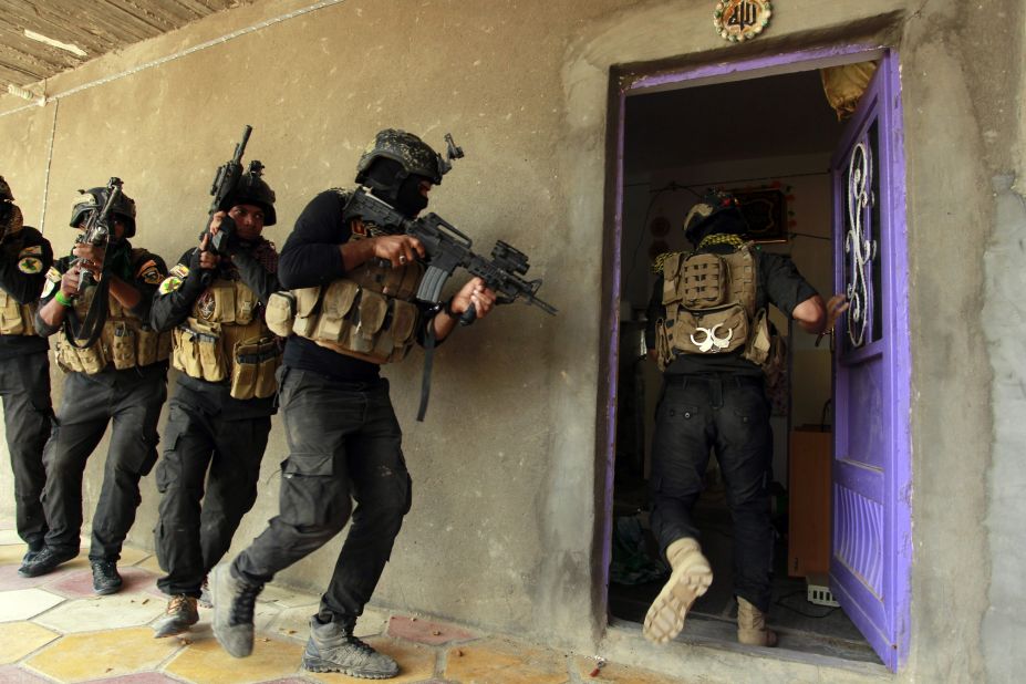 Iraqi special forces search a house in Jurf al-Sakhar, Iraq, on Thursday, October 30, after retaking the area from ISIS.