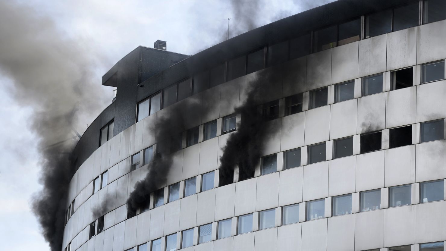 Smoke billows from windows during a fire Friday at the Radio France building in Paris.
