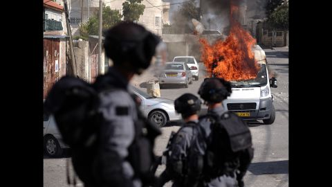 A van burns in Jerusalem during clashes between Palestinians and Israeli security forces on October 30. 