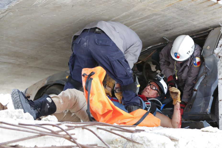 <a href="http://www.cnn.com/SPECIALS/us/original-series-mike-rowe-somebodys-gotta-do-it/index.html" target="_blank">Mike Rowe, host of CNN's "Somebody's Gotta Do It,"</a> gets rescued by Texas A&M paramedics during a training exercise. Click through the gallery for more images of folks who #GottaDoIt and watch CNN in 2015 for Season 2.