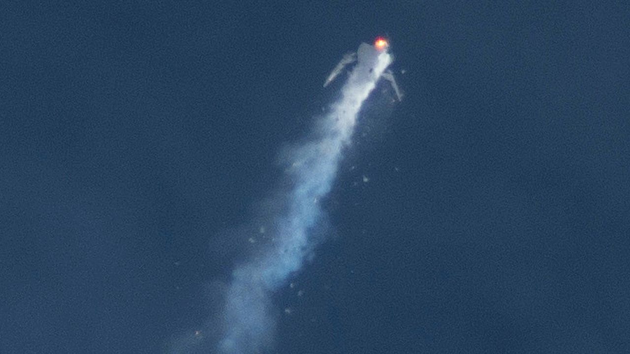 The Virgin Galactic SpaceShipTwo rocket explodes in the air during a test flight on Friday, Oct. 31, 2014. The explosion killed a pilot aboard and seriously injured another while scattering wreckage in the Mojave Desert.