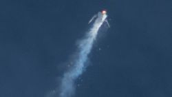 The Virgin Galactic SpaceShipTwo rocket explodes in the air during a test flight on Friday, Oct. 31, 2014. The explosion killed a pilot aboard and seriously injured another while scattering wreckage in Southern California's Mojave Desert, witnesses and officials said. (AP Photo/Kenneth Brown)