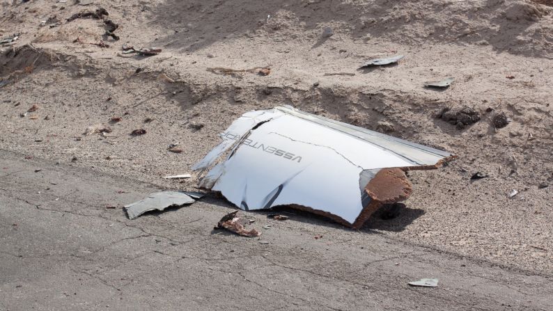 Debris from the rocket is scattered on a road after the rocket exploded.