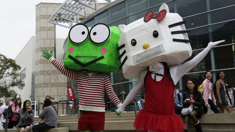 Mascots pose outside the convention.