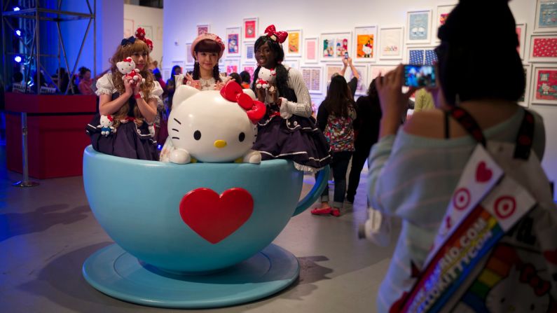 Hello Kitty fans pose for photos in a giant tea cup.