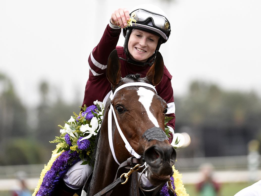 Rosie Napravnik celebrates atop Untapable after becoming the first female jockey to win the Breeders' Cup Distaff in Santa Anita, California. Napravnik would later announce she was retiring because she is seven weeks pregnant.