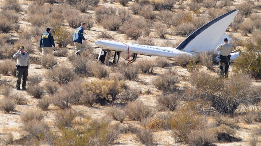 An National Transportation Safety Board (NTSB) team surveys a tail section from the crashed Virgin Galactic SpaceShipTwo near Cantil, California, on November 01, 2014.