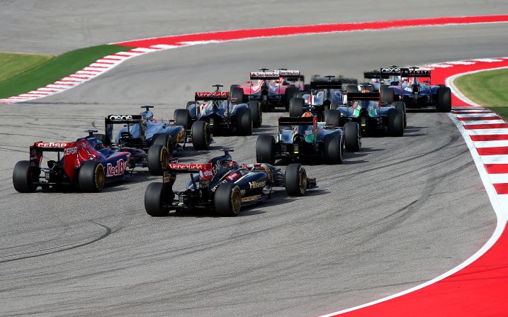 A cluster of cars head into the first corner at the Circuit of the Americas.