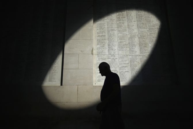 A shaft of sunlight falls on the names of the missing at the Menin Gate Memorial on the centenary of the Great War in Ypres, Belgium.