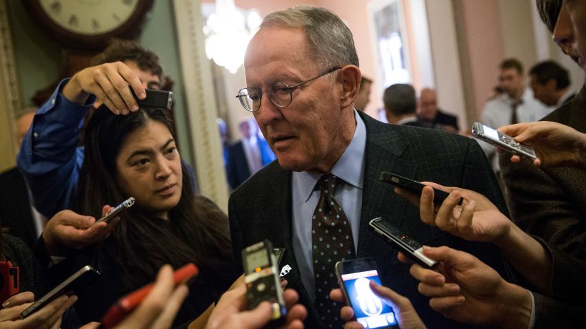 Sen. Lamar Alexander (R-TN) speaks to reporters before going into the Senate Chamber to vote, on October 12, 2013 in Washington, DC.