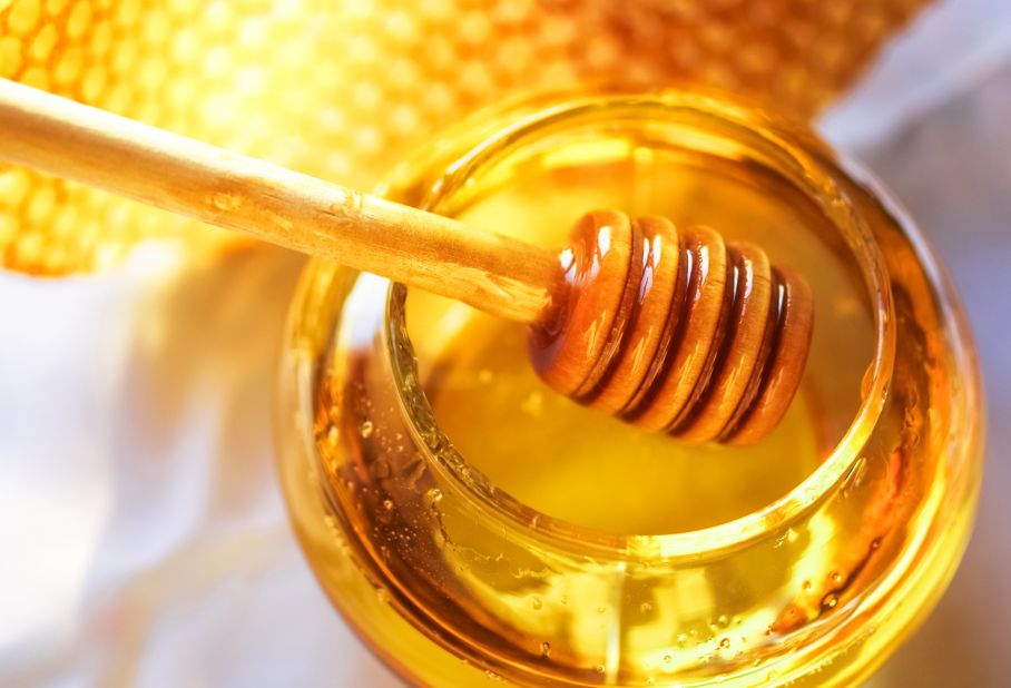 Honey is low in water and high in sugar, so bacteria cannot grow on it. It also contains small amounts of hydrogen peroxide, inhibiting the growth of microbes. 