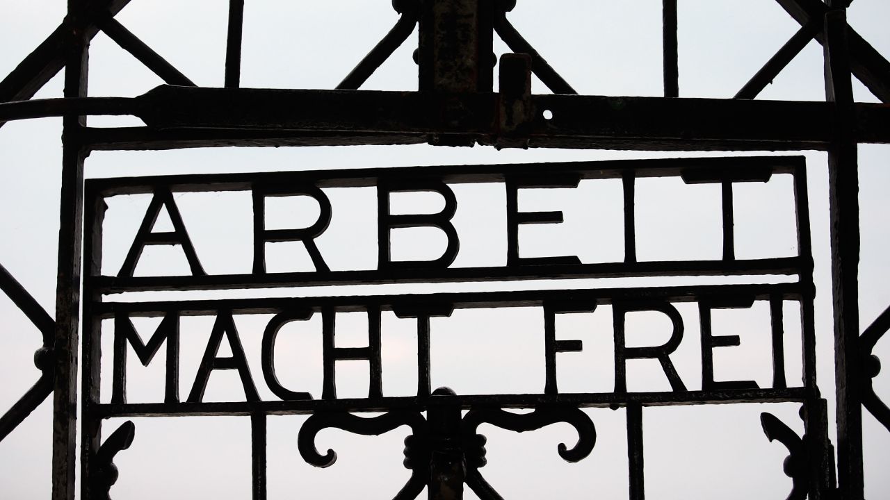 According to the Dachau Concentration Camp Memorial, the gate was forged by inmates in one of the camp's workshops after it first opened in 1933 for political prisoners.