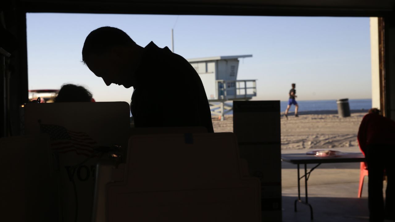 A voter casts his ballot at a polling place set up at the Venice Beach lifeguard headquarters in Los Angeles.