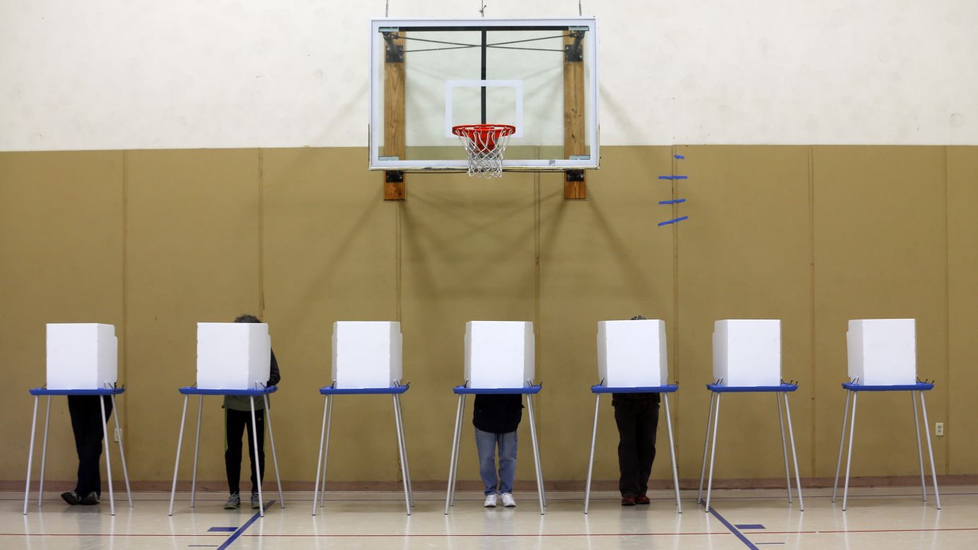 People vote in a gym at the St. Sophia Greek Orthodox Church in Albany, New York.