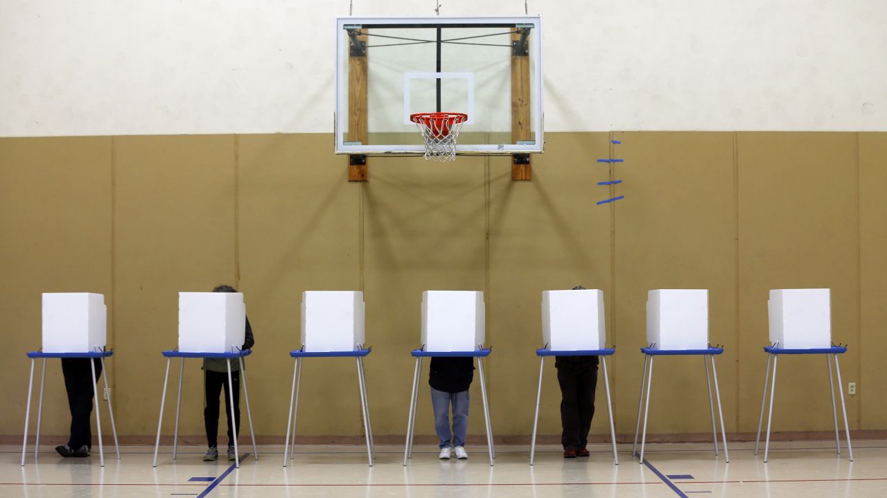 People vote in a gym at the St. Sophia Greek Orthodox Church in Albany, New York.