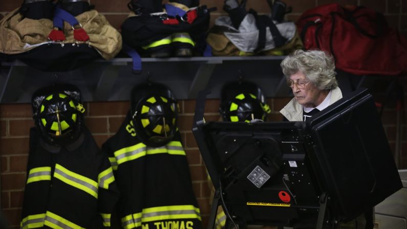 A voter casts her ballot at a fire station in Climax, North Carolina.