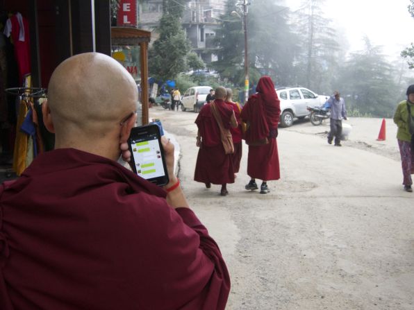 Despite living the simple life, many monks can be seen with technology such as smart phones.