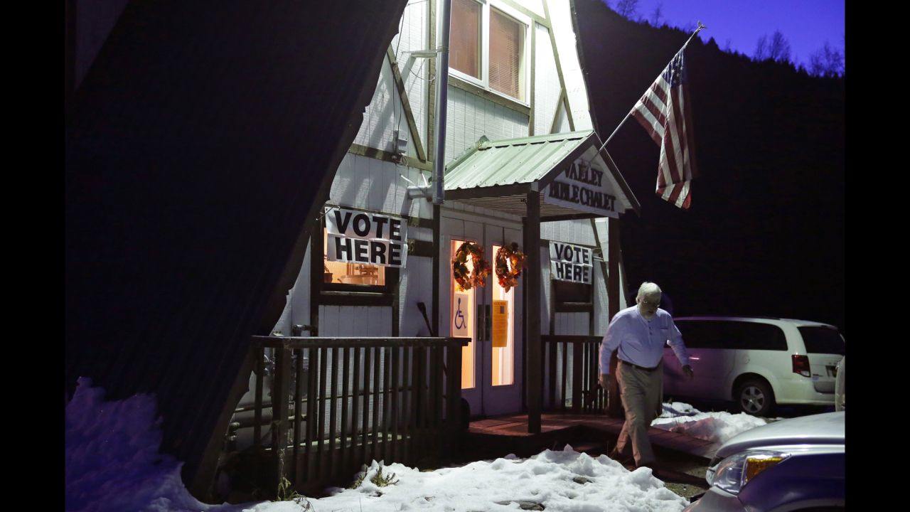 A voter exits the Valley Bible Chalet, which is a polling location in Indian, Alaska.