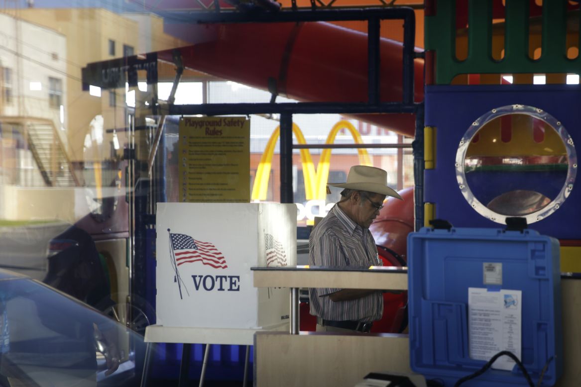 People in Los Angeles vote at a polling place set up in the playground of a McDonald's.