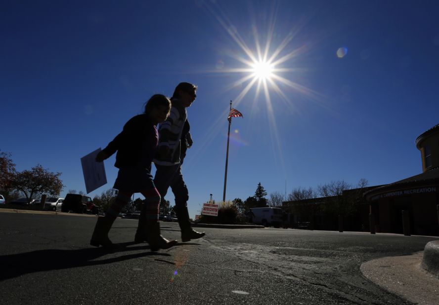 Voters in Thornton, Colorado, head into a polling place to drop off their ballots on Election Day.