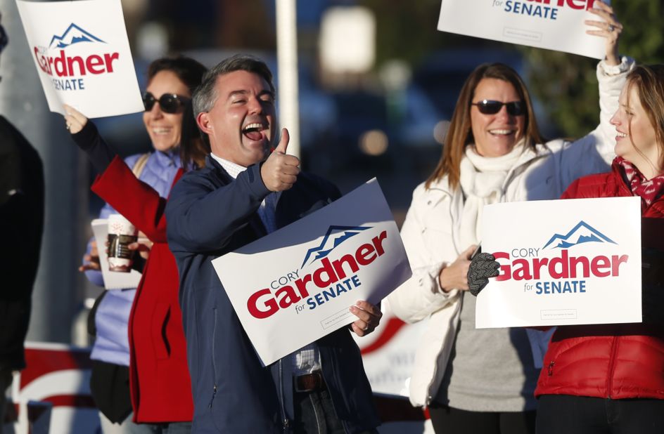 Gardner joins supporters on the corner of a major intersection in Centennial, Colorado, a Denver suburb, on Election Day.