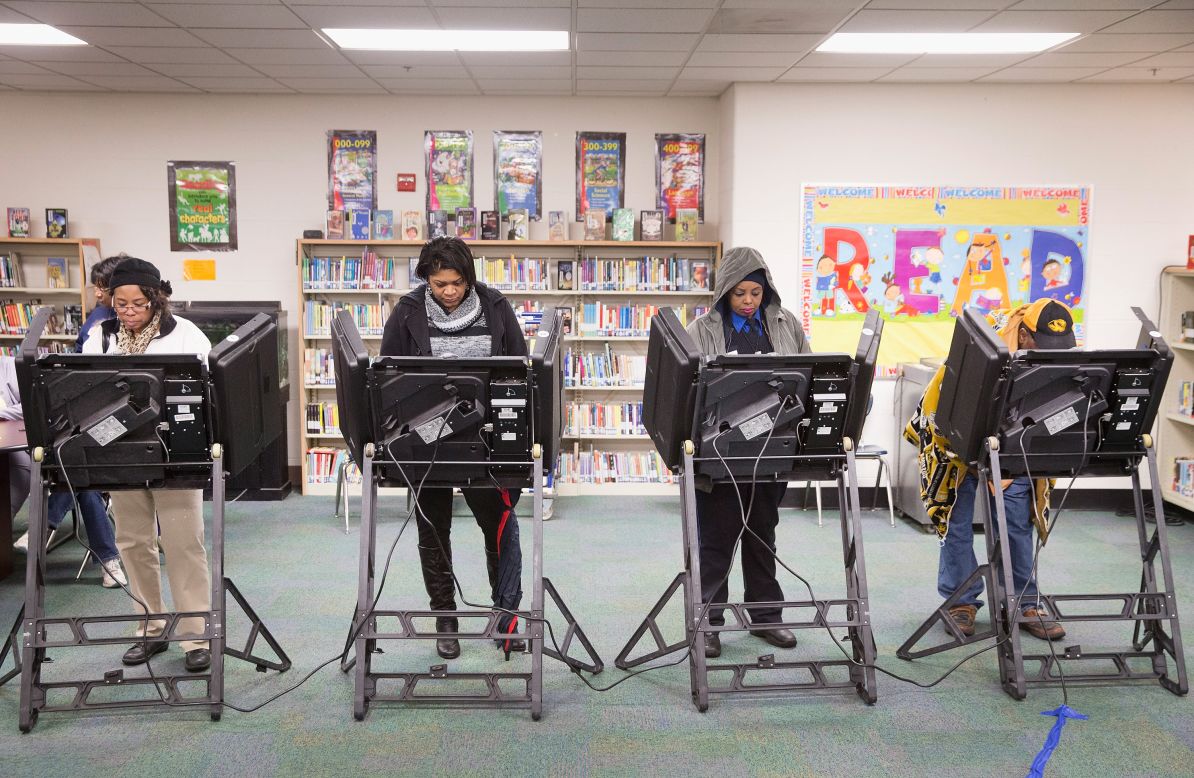 People vote in a library near Ferguson, Missouri.