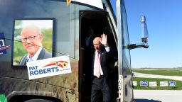 Kansas U.S. Sen. Pat Roberts waves to supporters as he arrives at the Kansas Speedway for the "Vote the Kansas way bus tour" on the campaign trail on October 31,  2014 in Kansas City Kansas 