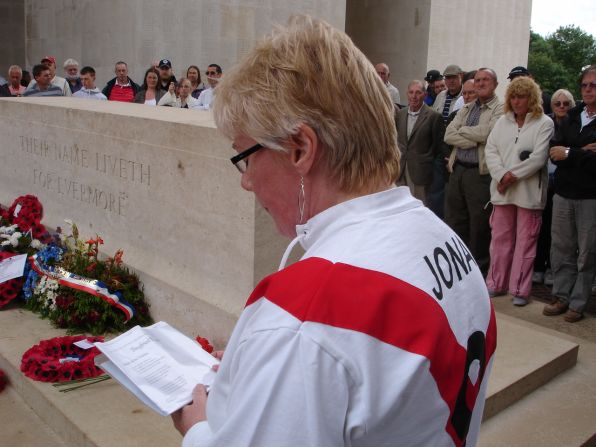 Theresa Burns, wearing a Clapton Orient shirt with the surname of Jonas, the former Orient player, on the back, reads a poem in homage to the fallen.
