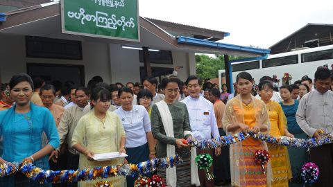 Aung San Suu Kyi (c) pictured opening a new mobile library in Kawhmu township on the outskirts of Yangon in 2013.