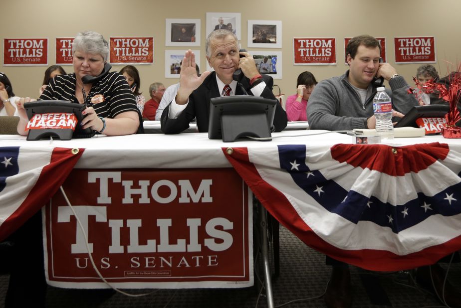 Tillis waves to a supporter as he makes calls at his campaign office in Cornelius on November 3.
