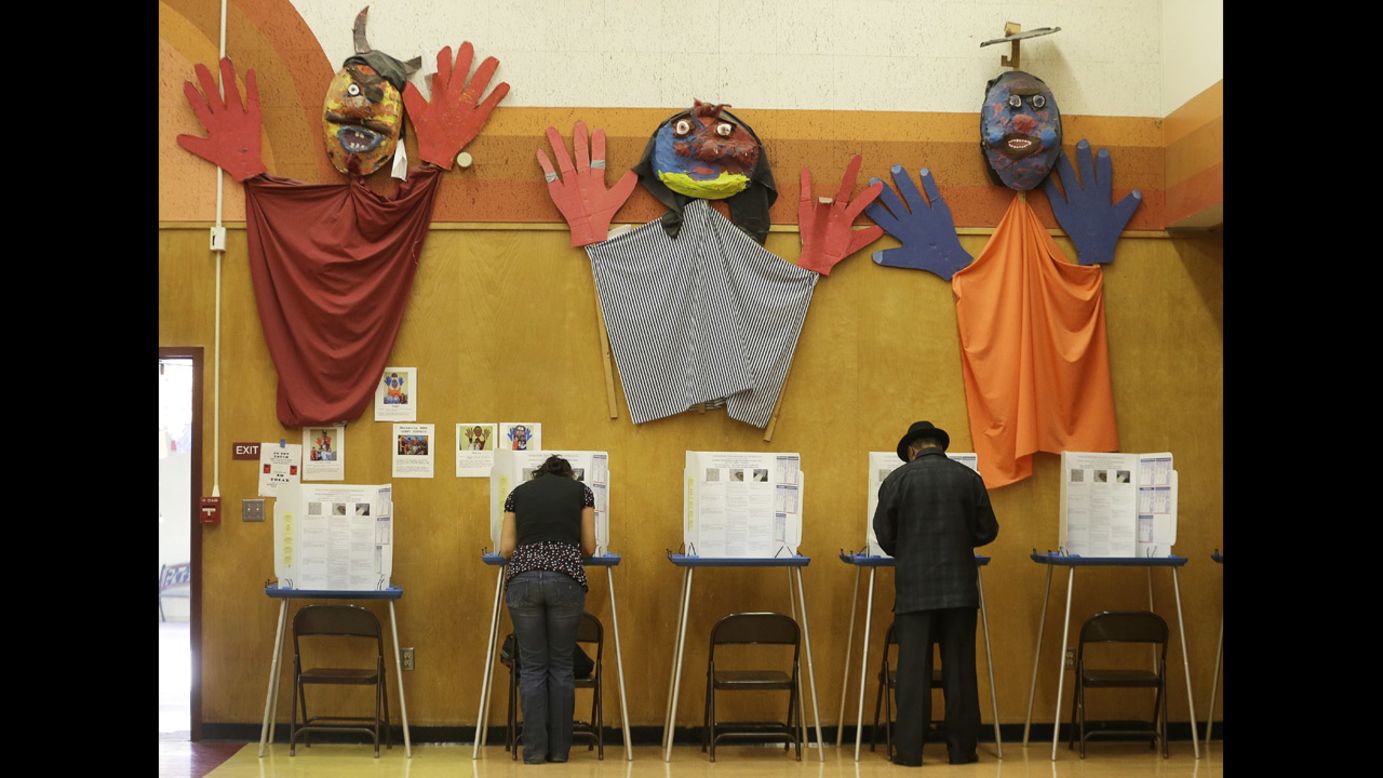 Voters cast ballots at Manzanita Community School in Oakland, California. 