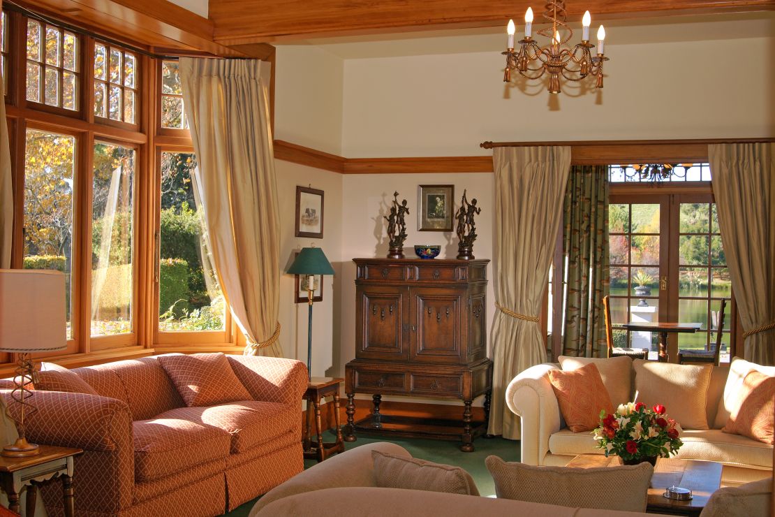 The cozy 1920s style rooms overlook Lake Timara, the Richmond Range mountains and a 25-acre garden.