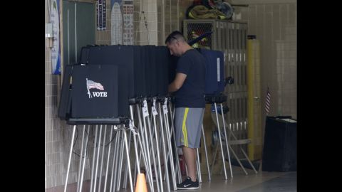 A man casts his ballot inside a Miami fire station on November 4.