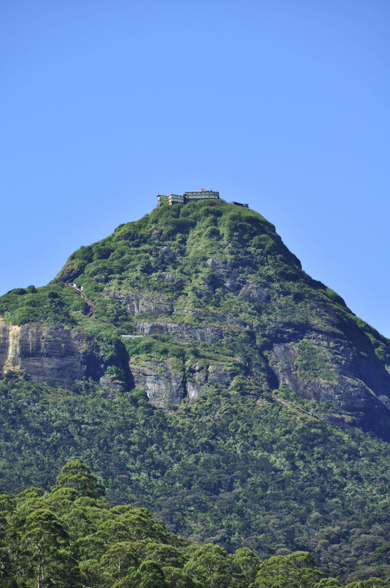 The 2,243-meter peak is one of Sri Lanka's highest mountains. It lies among the southern Central Highlands of the Ratnapura district, 150 kilometers east of Sri Lanka's capital, Colombo. 