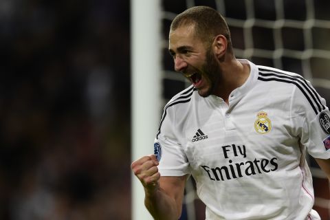 Karim Benzema's first half finish gave Real Madrid a 1-0 victory over Liverpool and seal its place in the knockout phase.